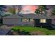 House exterior view at dusk, showcasing the home's curb appeal at 3067 S Holly Pl, Denver, CO 80222