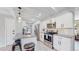 Modern kitchen with stainless steel appliances and granite countertops at 3067 S Holly Pl, Denver, CO 80222