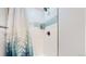 Clean shower with white subway tile and a blue accent band at 3067 S Holly Pl, Denver, CO 80222