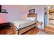 Bright bedroom with wood flooring and a wooden bed frame at 1350 Josephine St # 401, Denver, CO 80206
