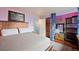Main bedroom with a king-size bed and built-in shelving at 1350 Josephine St # 401, Denver, CO 80206