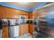 Modern kitchen with wood cabinets, granite counters, and stainless steel appliances at 1350 Josephine St # 401, Denver, CO 80206