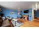 Cozy living room features hardwood floors, a fireplace, and ample seating at 1350 Josephine St # 401, Denver, CO 80206