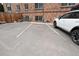 Exterior view of a parking lot with designated spaces at 1350 Josephine St # 401, Denver, CO 80206