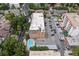Aerial view of building, pool, and parking area at 1350 Josephine St # 401, Denver, CO 80206