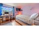 Bedroom with wood floors, a large bed, and a workspace at 1350 Josephine St # 401, Denver, CO 80206