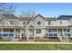 Three-unit townhouse complex with blue accents and grassy yards at 1382 S Cathay Ct # 103, Aurora, CO 80017