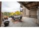 Private patio with seating area and view at 6000 W Floyd Ave # 107, Denver, CO 80227