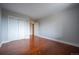 Spacious bedroom with hardwood floors and double closets at 6000 W Floyd Ave # 107, Denver, CO 80227