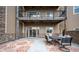 Private patio with seating area and view at 6000 W Floyd Ave # 107, Denver, CO 80227