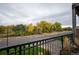 View of trees and parking from balcony at 6000 W Floyd Ave # 107, Denver, CO 80227