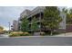 Condo building exterior showcasing multiple units at 6000 W Floyd Ave # 107, Denver, CO 80227