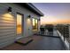 Rooftop deck at sunset with lounge chairs and city views at 9052 Harlan St, Westminster, CO 80031