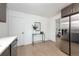 Modern kitchen with stainless steel appliances and gray cabinets at 177 Wolff St, Denver, CO 80219