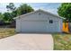Detached garage with double doors and driveway at 177 Wolff St, Denver, CO 80219