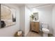 Modern basement bathroom with wood vanity and white fixtures at 177 Wolff St, Denver, CO 80219