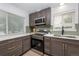 Modern kitchen with stainless steel appliances and gray cabinets at 177 Wolff St, Denver, CO 80219
