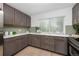 Modern kitchen with stainless steel appliances and updated cabinetry at 177 Wolff St, Denver, CO 80219