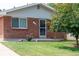Brick ranch house with a well-maintained lawn at 177 Wolff St, Denver, CO 80219