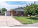 Brick ranch house with a well-maintained lawn at 177 Wolff St, Denver, CO 80219