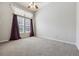 Spacious bedroom with carpet flooring and large windows at 5155 W Quincy Ave # E104, Denver, CO 80236