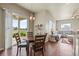 Bright dining area with hardwood floors and access to a patio at 10790 E 163Rd Ct, Brighton, CO 80602