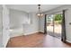 Bright dining room with hardwood floors and sliding glass doors leading to backyard at 19873 E Vassar Ave, Aurora, CO 80013