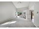 Spacious living room with vaulted ceilings, fireplace, and carpeting at 19873 E Vassar Ave, Aurora, CO 80013