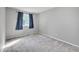 Cozy bedroom with neutral walls and carpeted floors at 19873 E Vassar Ave, Aurora, CO 80013