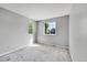 Well-lit bedroom with neutral walls and carpeted floors at 19873 E Vassar Ave, Aurora, CO 80013