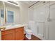 Bathroom with walk-in shower and built-in tub at 19873 E Vassar Ave, Aurora, CO 80013