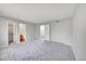 Spacious Primary bedroom with plush carpeting and an ensuite bathroom at 19873 E Vassar Ave, Aurora, CO 80013