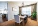 Elegant dining room with chandelier and hardwood floors at 4163 Eagle Tail Ln, Castle Rock, CO 80104