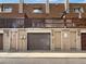 Exterior view showing building with garages and private balconies at 5670 S Lowell Blvd, Littleton, CO 80123