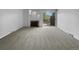 Bright living room with fireplace and sliding glass door to deck at 5670 S Lowell Blvd, Littleton, CO 80123