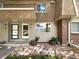Neatly landscaped exterior of a townhome with double doors at 5670 S Lowell Blvd, Littleton, CO 80123