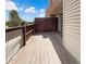Private deck with wooden railings and view of trees at 5670 S Lowell Blvd, Littleton, CO 80123