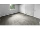 Simple bedroom with grey carpet and large window at 5670 S Lowell Blvd, Littleton, CO 80123