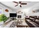 Spacious living room with a fireplace and a view to the backyard at 12192 W Layton Ave, Morrison, CO 80465