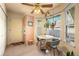 Breakfast nook with bay window, ceiling fan, and tile floor at 9312 Miles Dr, Lone Tree, CO 80124