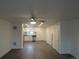 Open concept living room and kitchen with dark hardwood floors at 3786 N Gaylord St, Denver, CO 80205