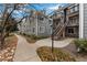 Townhome building with walkway and autumn leaves at 12525 E Tennessee Cir # E, Aurora, CO 80012