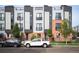 Modern three-story townhome with brick and metal siding at 2589 Arapahoe St, Denver, CO 80205