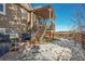 Back exterior showing deck, stairs, and grill area at 3958 Scarlet Oak Ct, Castle Rock, CO 80109