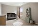 Bedroom with crib, bookshelf, and changing table at 13960 Scarlet Sage Ln, Parker, CO 80134