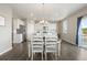 Charming dining area with a farmhouse table and chairs, adjacent to the kitchen at 13960 Scarlet Sage Ln, Parker, CO 80134