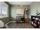 Functional home office with built-in shelving, desk, and comfortable chair at 13960 Scarlet Sage Ln, Parker, CO 80134