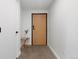 Bright entryway with light wood door and concrete floors at 1601 Park Ave # 110, Denver, CO 80218