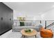 Bright living room with gray sofa and wood coffee table at 1601 Park Ave # 110, Denver, CO 80218