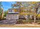 Two-story house with a double garage and autumn trees at 2605 S Olathe Way, Aurora, CO 80013